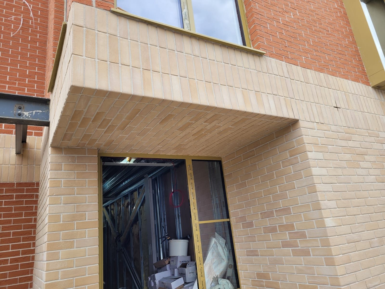 Brick Slip Cladding (Licata, Eurobrick &Amp; Ewi Pro) | Ewi Specialists Ltd Buff brick slip cladding porch detail on a new-build home in London