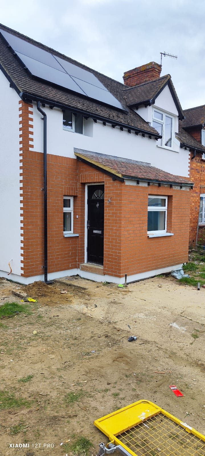 Brick Slip Cladding (Licata, Eurobrick &Amp; Ewi Pro) | Ewi Specialists Ltd Brick slip cladding and render on a family home in Godalming, Surrey