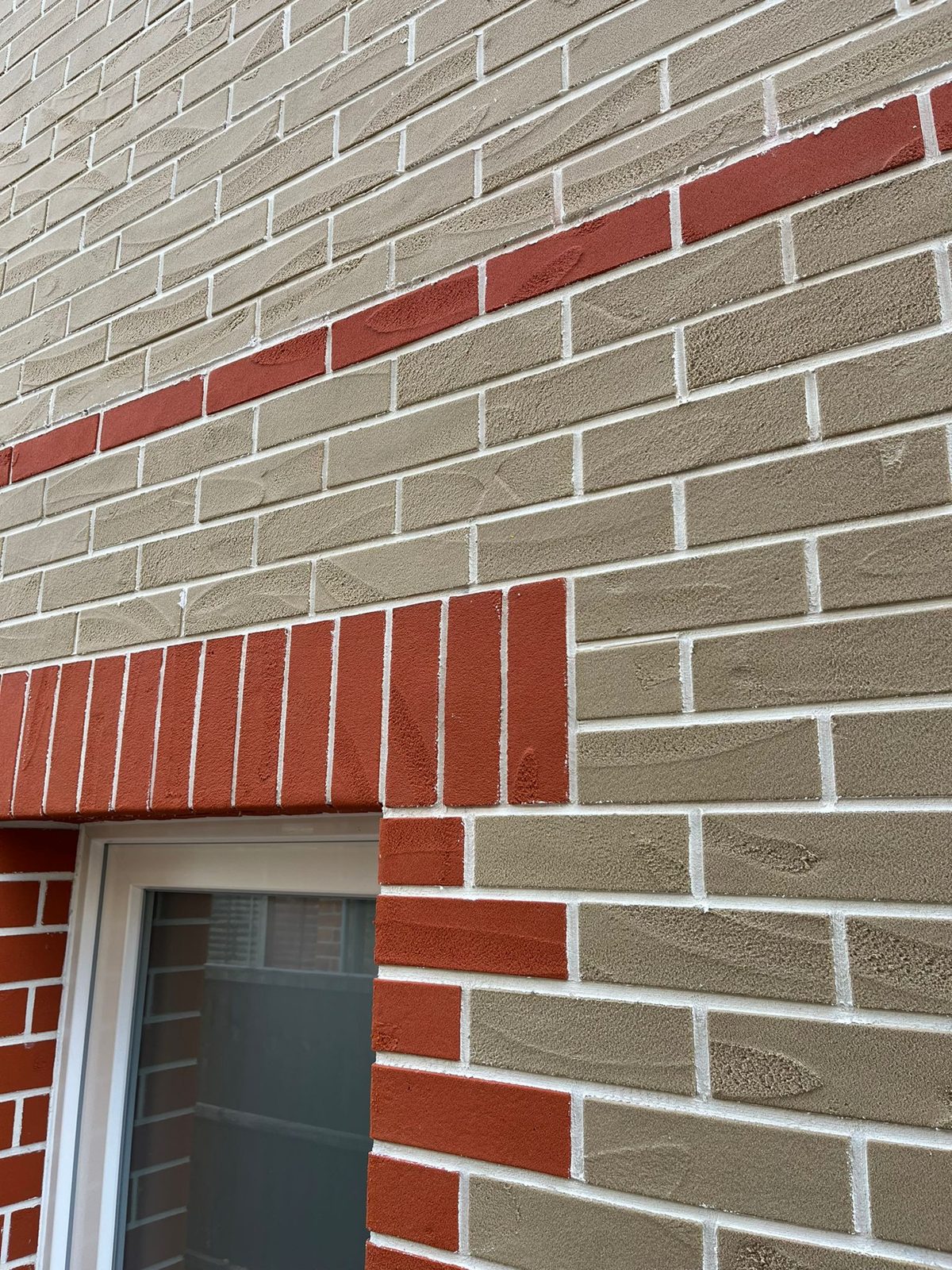 Brick Slip Cladding (Licata, Eurobrick &Amp; Ewi Pro) | Ewi Specialists Ltd Close-up of brick slip cladding with red soldier course window detail